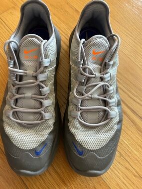 Nike Gray Sneakers with Orange Tongue Logo & Blue Swoosh